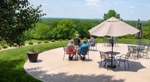 Back patio with guests enjoying the view