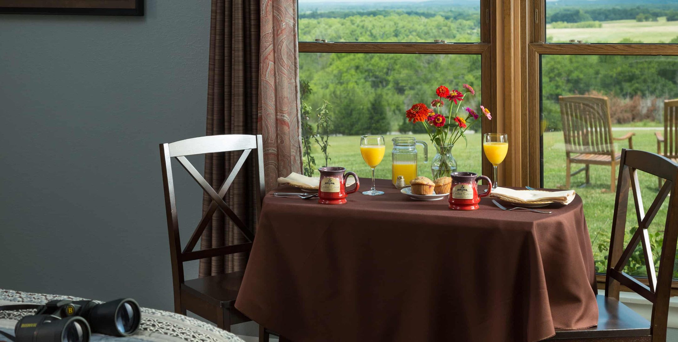 Country Meadow Room dining area with breakfast on the table