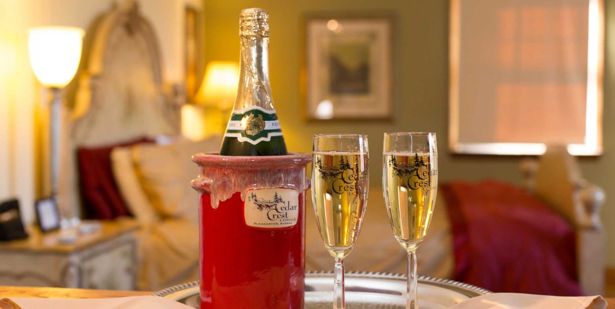 Close up of Champagne in ice bucket and two glasses