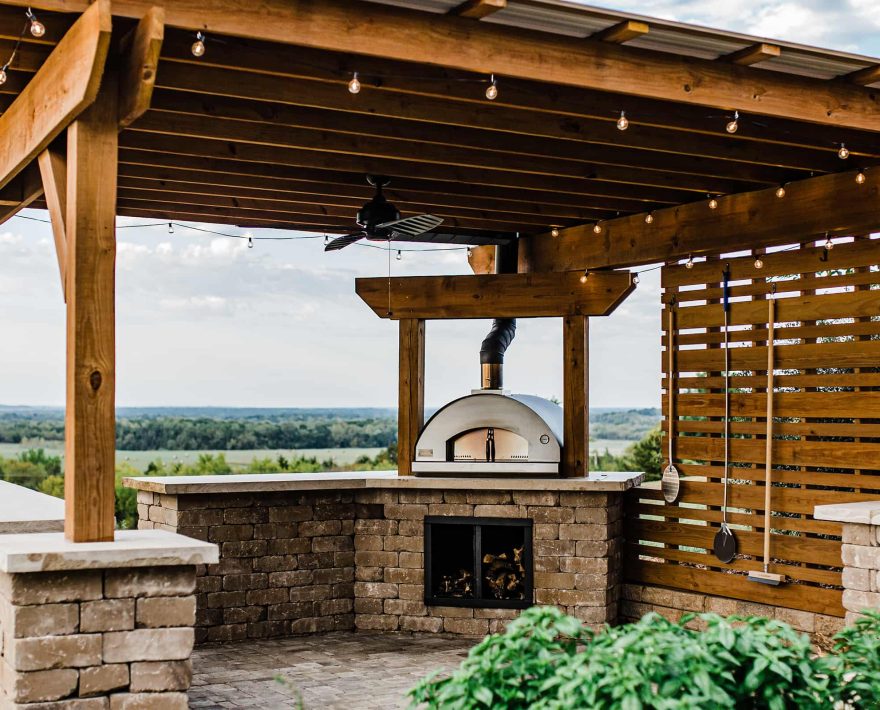 Pizza oven pergola with patio lights at Pleasanton, KS restaurant