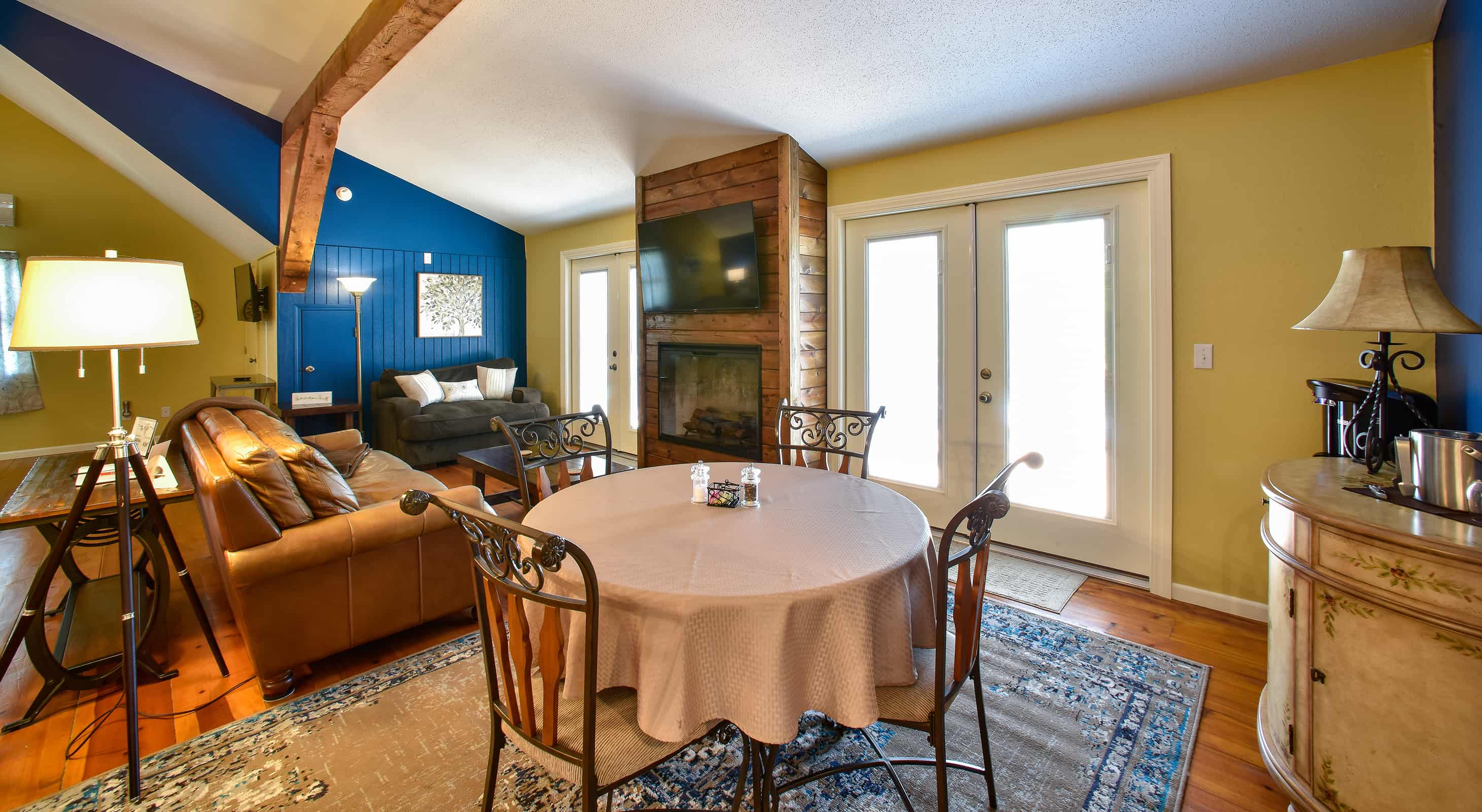 Kansas lodging in the Tuscan Manor Suite with a sitting area and dining table