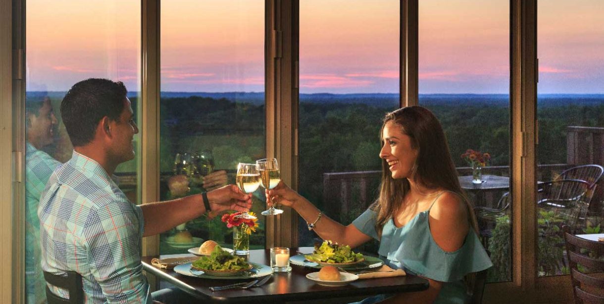 Couple having romantic dinner at sunset