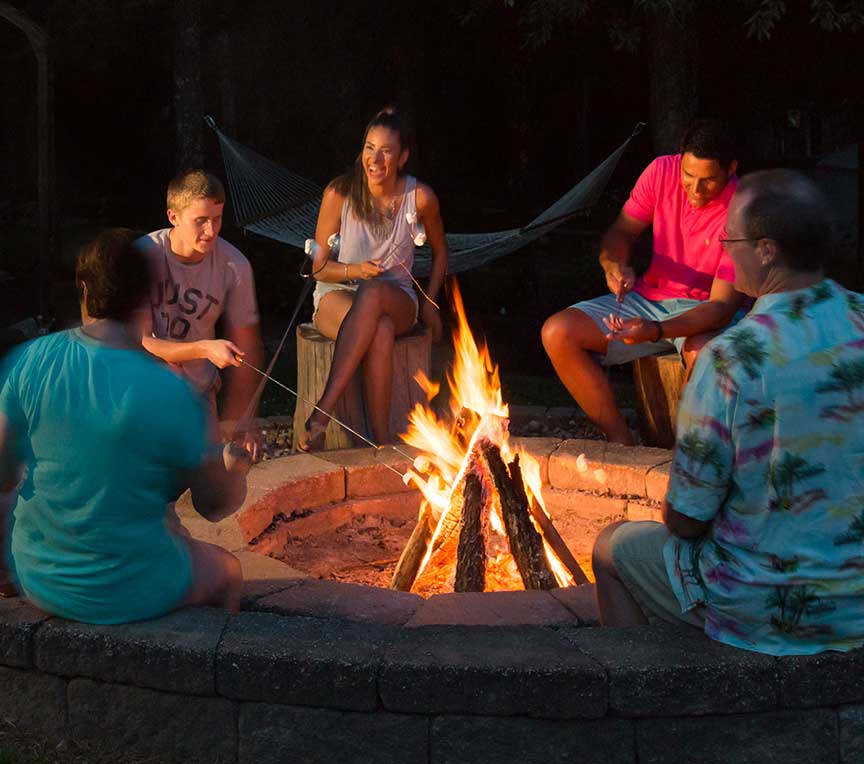 Friends sitting around a firepit