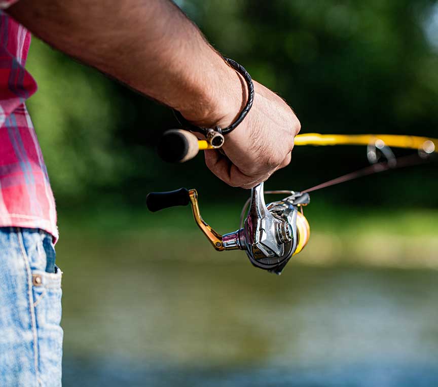 Close up of man fishing in a pond