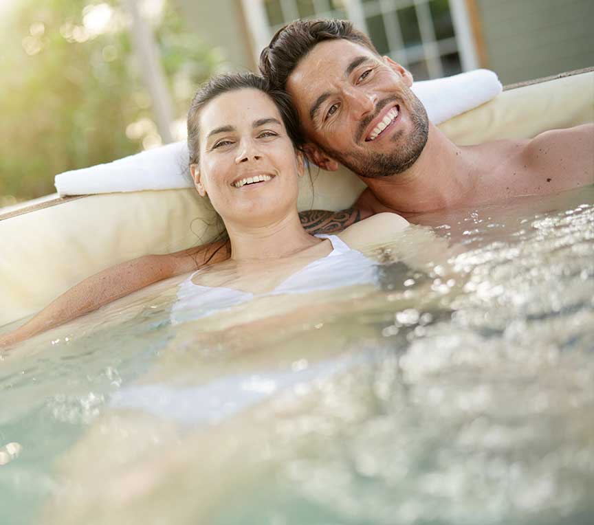 Couple relaxing in a hot tub