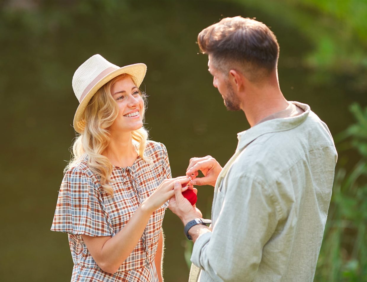 man proposing to woman by pond in Kansas
