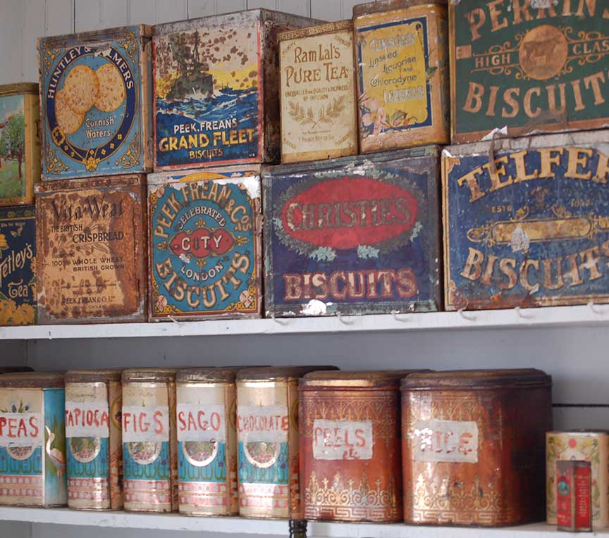 Antique vintage cans on shelves