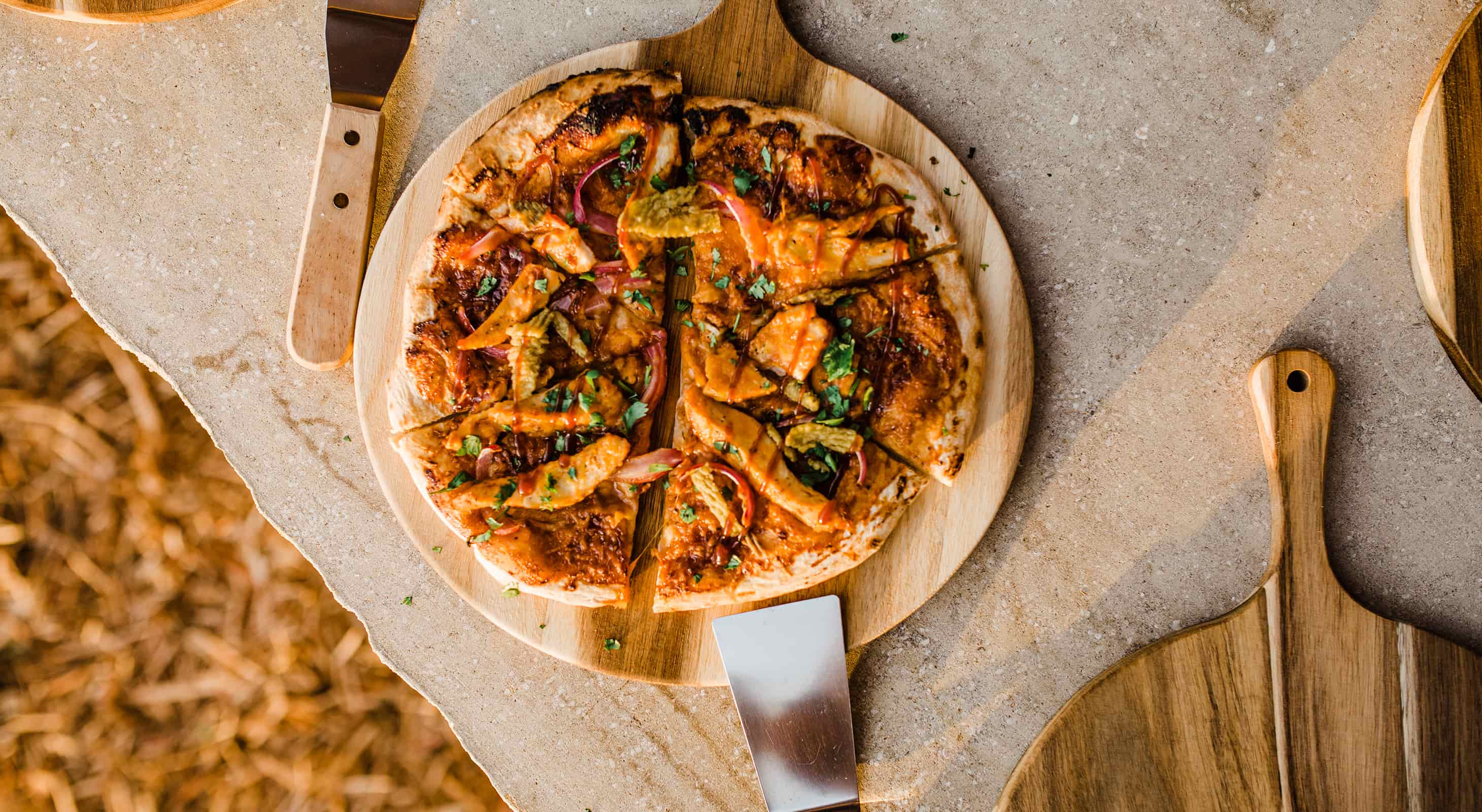 Overhead view of gourmet wood-fired pizza at Pleasanton, KS restaurant