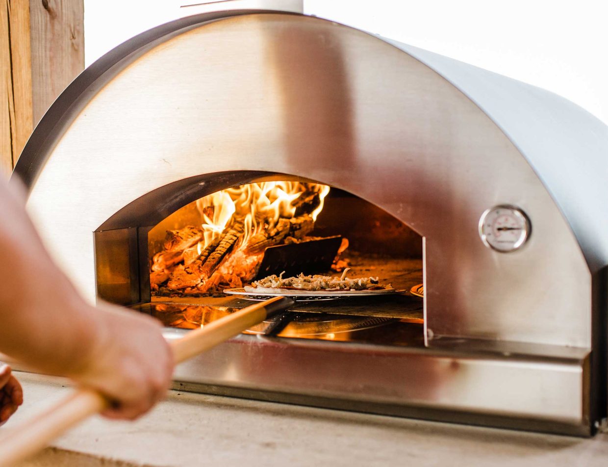 Wood-fired pizza in the pizza oven