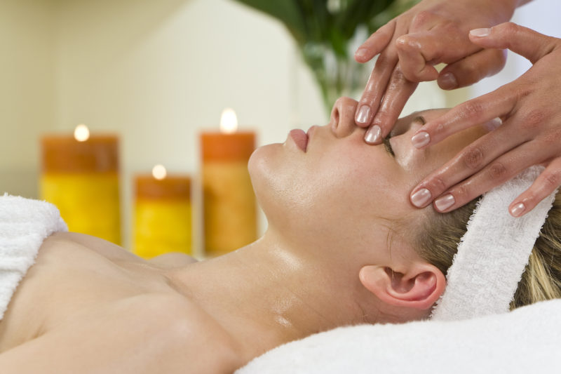 Woman receives facial treatment during her fall getaway at Cedar Crest Lodge.