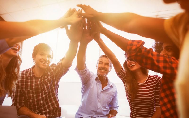 Group of Corporate Team with Hands in the Middle